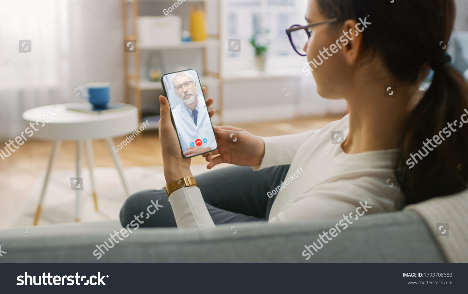 Young Girl Sick at Home Using Smartphone to Talk to Her Doctor via Video Conference Medical App. Woman Checks Possible Symptoms with Professional Physician, Using Online Video Chat Application #1793708680