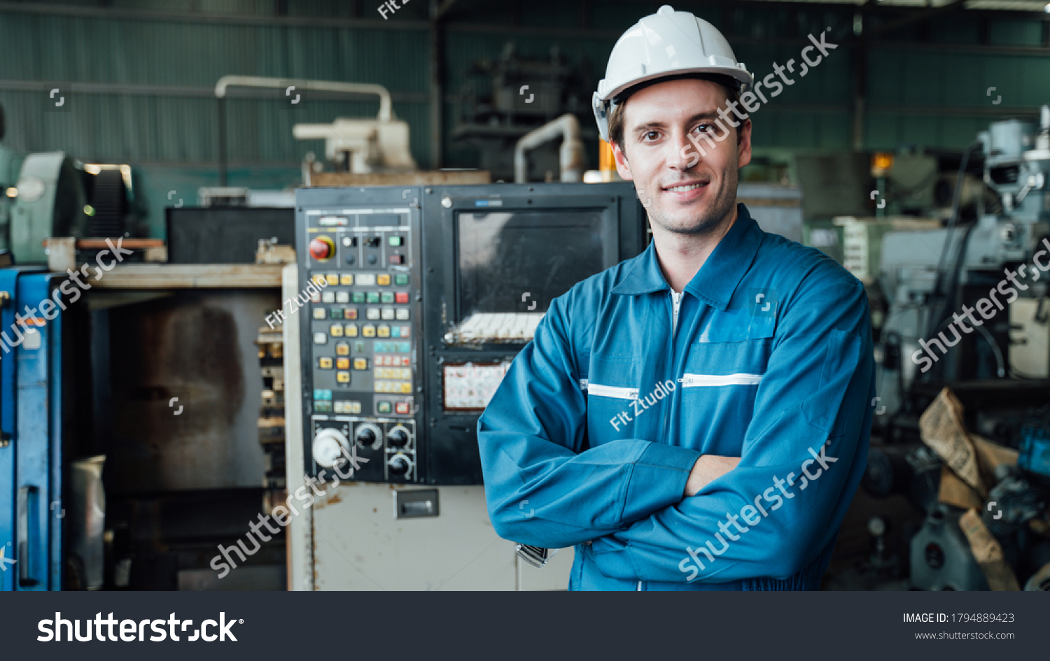 Engineer,Industry and construction concept. Portrait of caucasian Industry factory maintenance engineer wearing uniform and safety helmet in factory. #1794889423