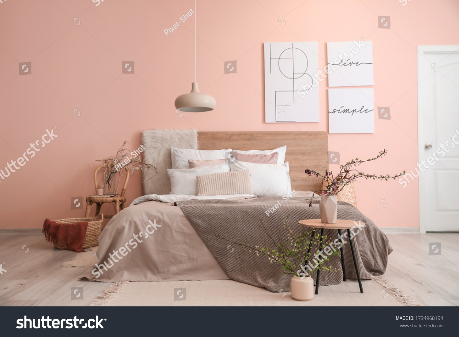Interior of beautiful modern bedroom with spring flowers #1794968194