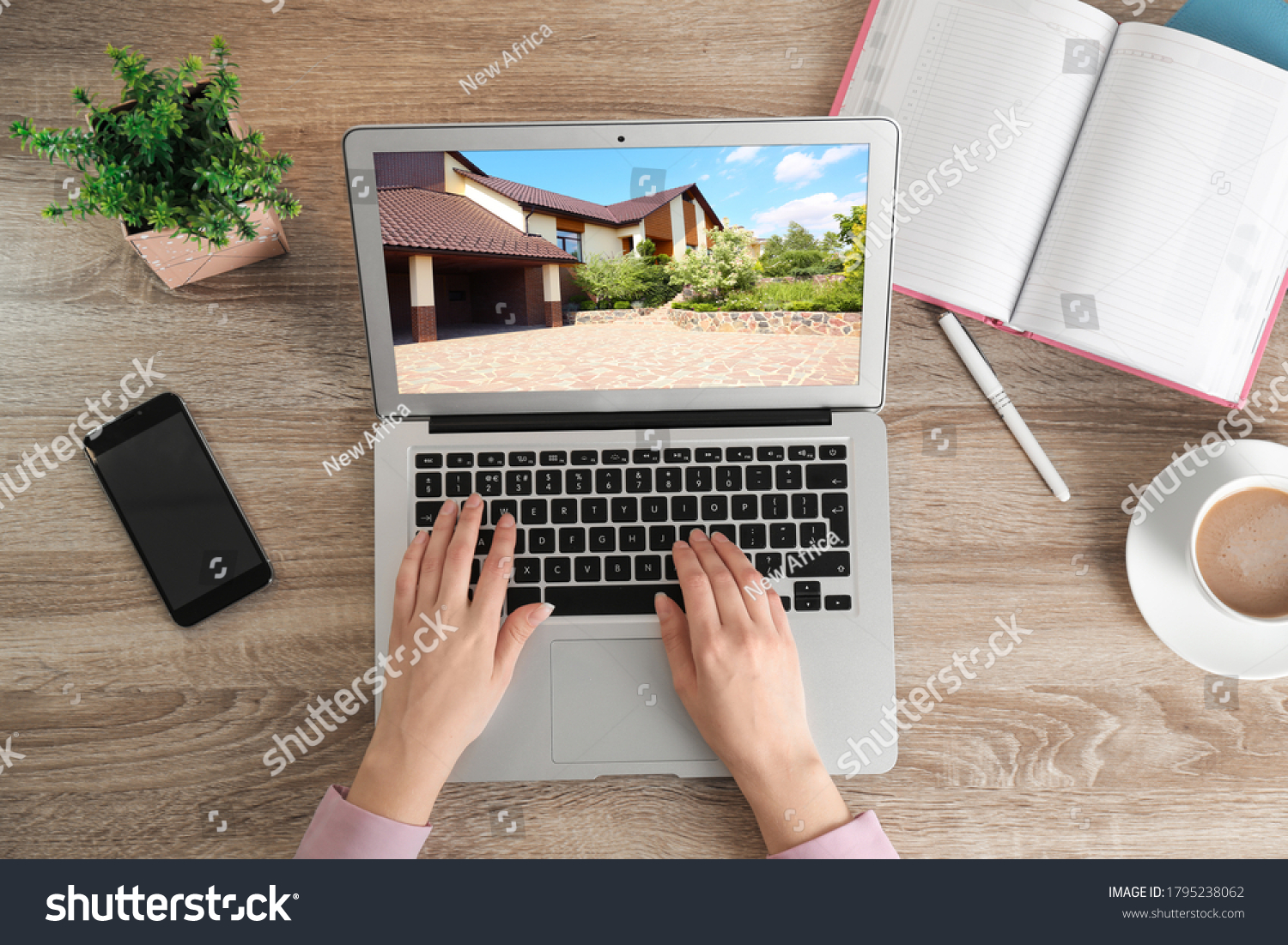 Woman choosing new house online using laptop or real estate agent working at table, top view #1795238062