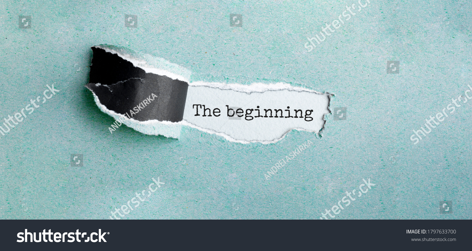 The text The beginning appearing behind torn brown paper #1797633700