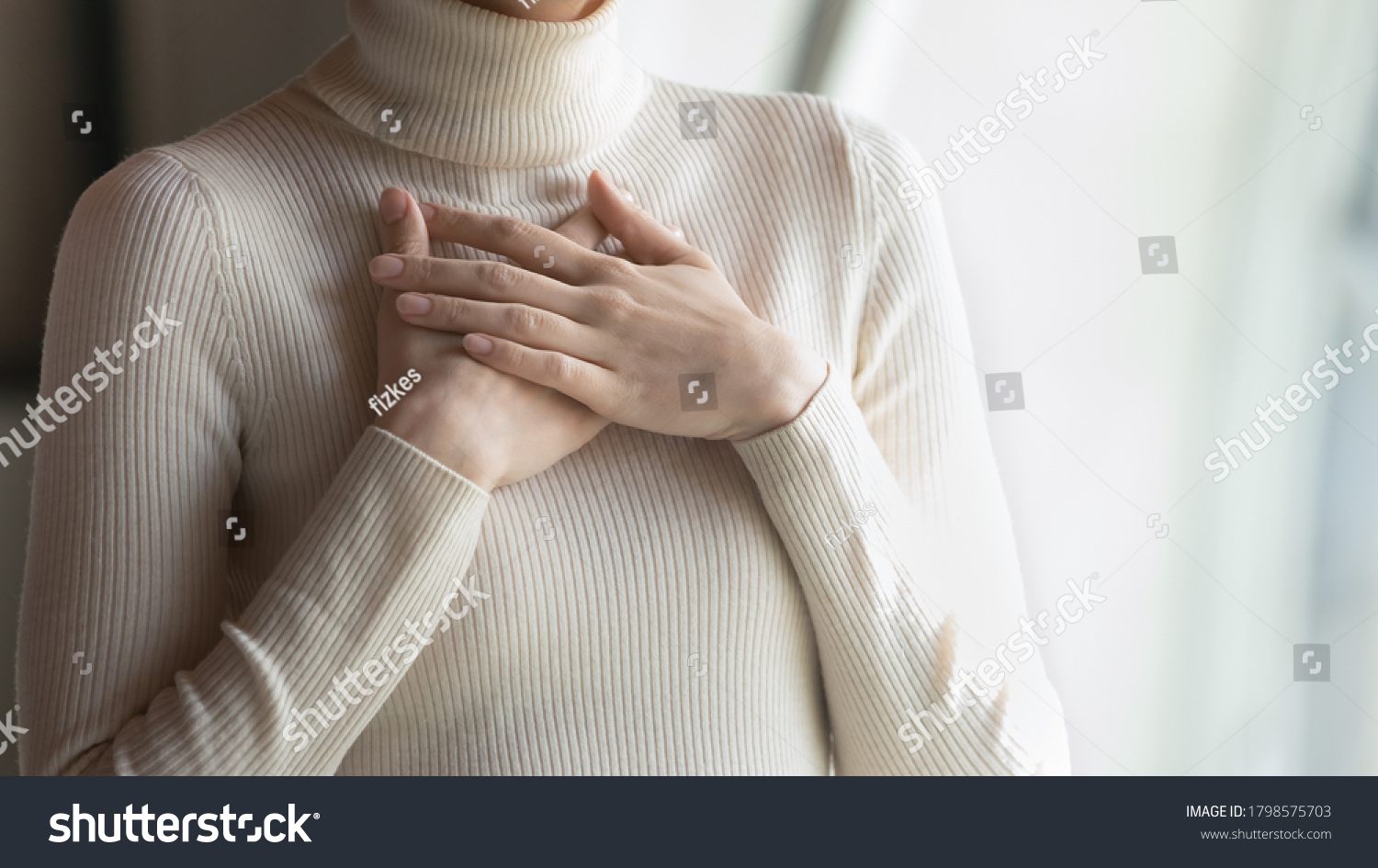 Close up focus on female hands, folded on chest. Happy young woman employee feeling thankful indoors, praying for good luck on important business meeting, dreaming of future, appreciation concept. #1798575703
