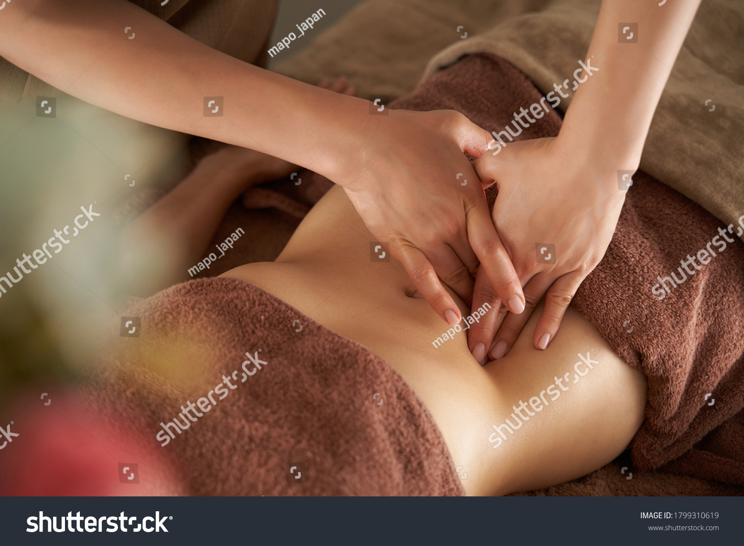 Japanese woman getting a belly massage at a beauty salon #1799310619