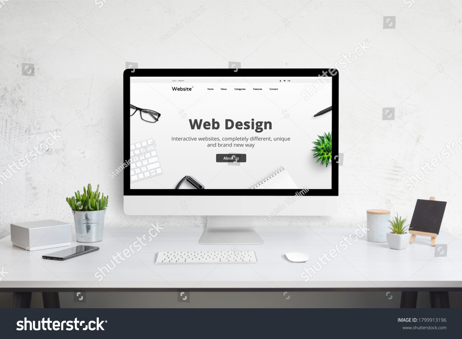 Web design company web site concept on computer display. Modern flat design website. Office desk with plants, phone, keyboard and mouse. #1799913196