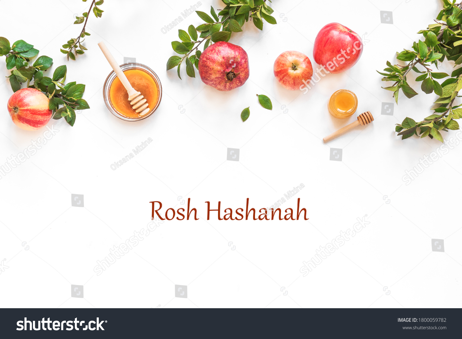 Rosh Hashanah jewish New Year holiday concept banner. Creative layout of traditional symbols - apples, honey, pomegranate isolated on white, top view, copy space. #1800059782