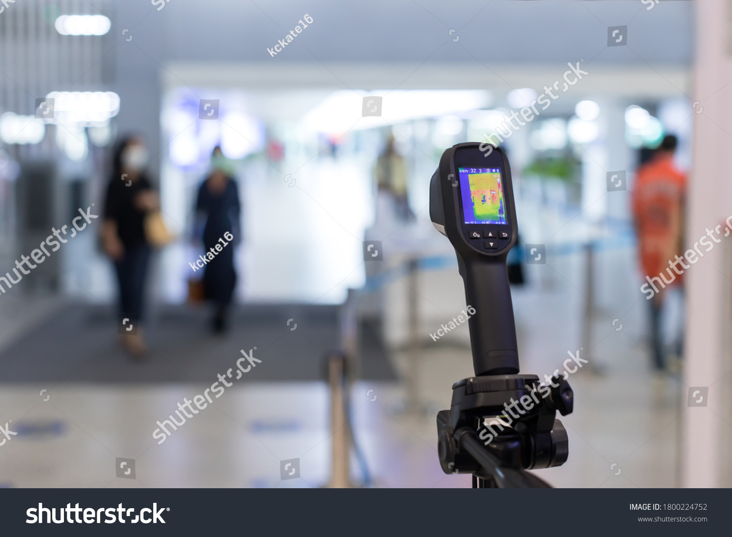 Thermal scanner to check the temperatures of passengers arriving airport. Automatic measuring temperature woman at hospital .Covid-19 test temperature for human. #1800224752