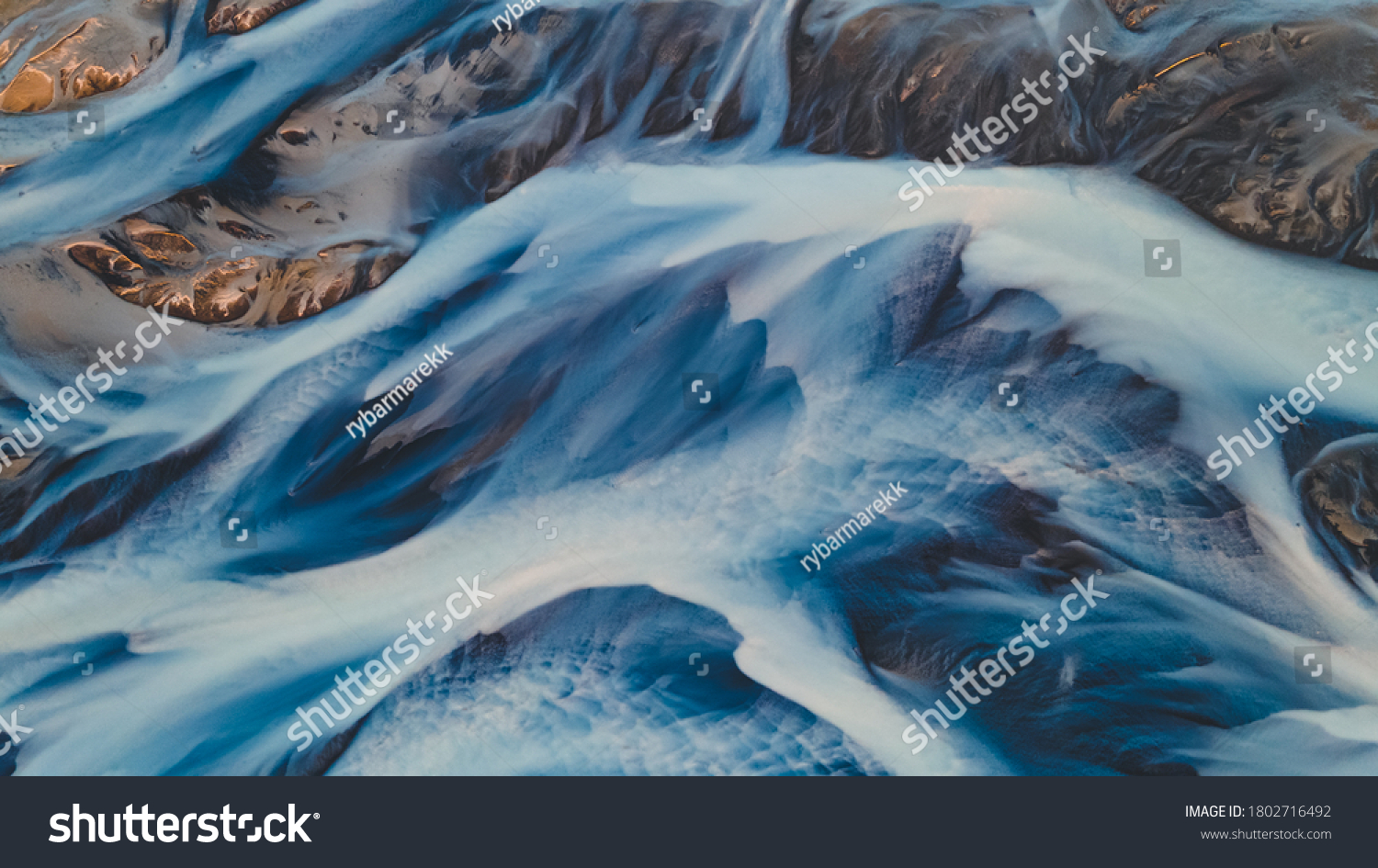 A glacial rivers from above. Aerial photograph of the river streams from Icelandic glaciers. Beautiful art of the Mother nature created in Iceland. Wallpaper background high quality photo #1802716492
