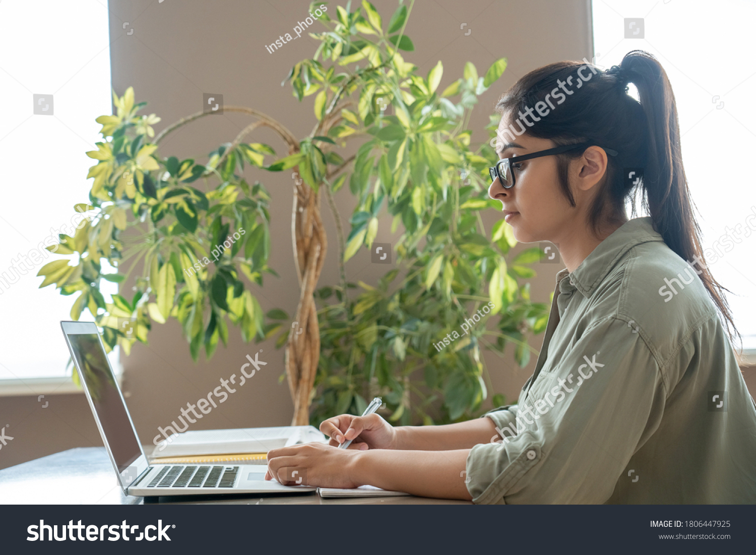 Indian woman online teacher, student, remote worker video conference calling, watching webinar training working studying at home office classroom. Female tutor giving webcam online class on laptop. #1806447925