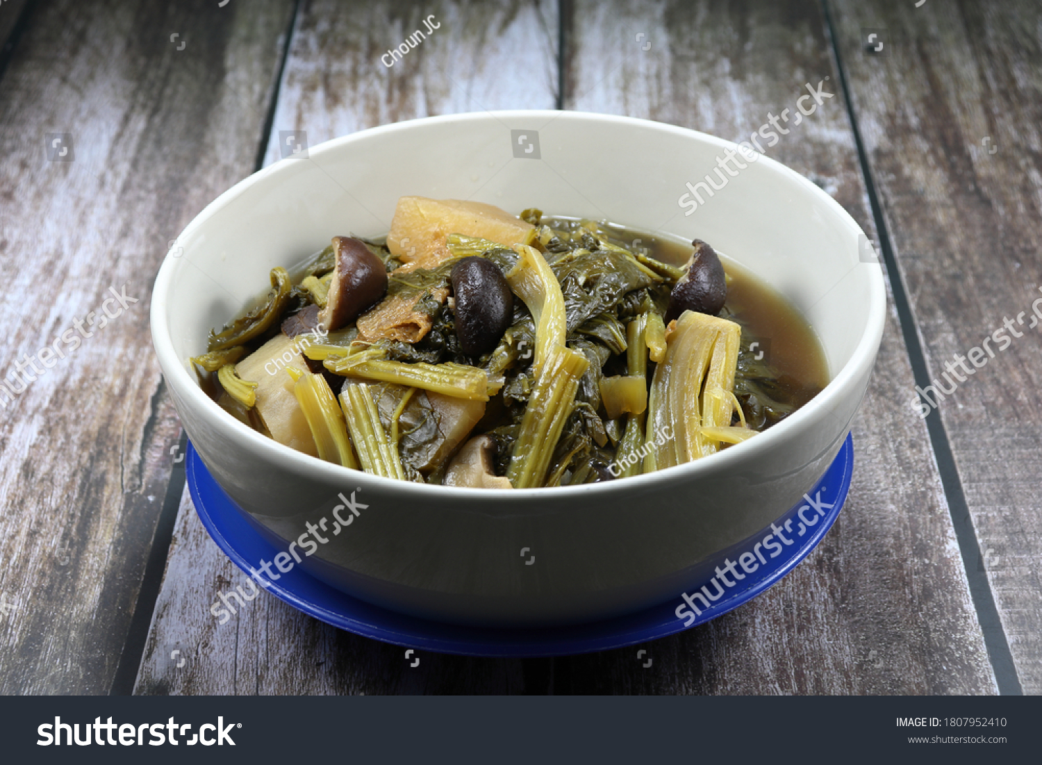 Chinese traditional boiled mix fresh organic vegetable in the bowl, White radish, Cantonese vegetable and cabbage. Famous menu in Chinese New Year and special ancient ceremony. #1807952410