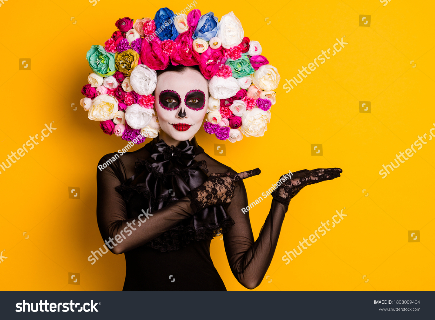 Portrait of her she nice-looking beautiful creepy confident lady holding on palm copy space advert discount Santa Muerte isolated bright vivid shine vibrant yellow color background #1808009404
