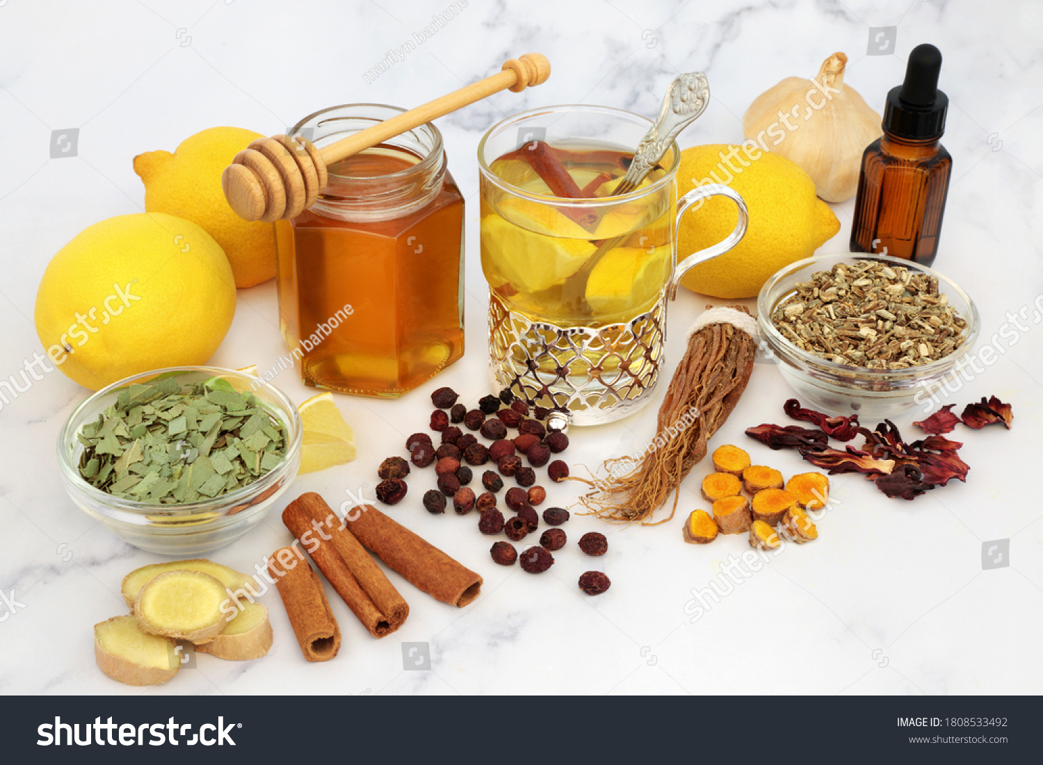 Natural medicinal herbal remedy for cold & flu virus with hot drink with fresh ginger, lemon, honey, cinnamon. echinacea, hawthorn berries, ginseng & eucalyptus essential oil. Immune boosting. #1808533492