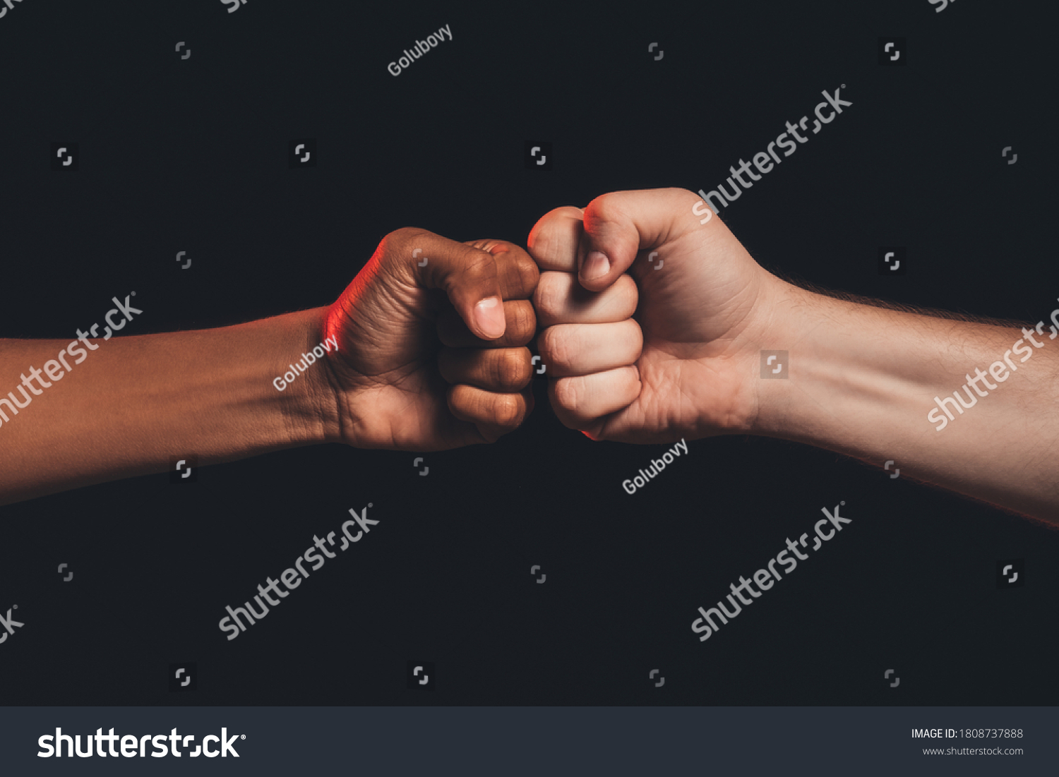 Black lives matter. Races fights. African caucasian male fists bumping isolated on dark copy space. Ethnic conflict. Human harassment. No racism #1808737888