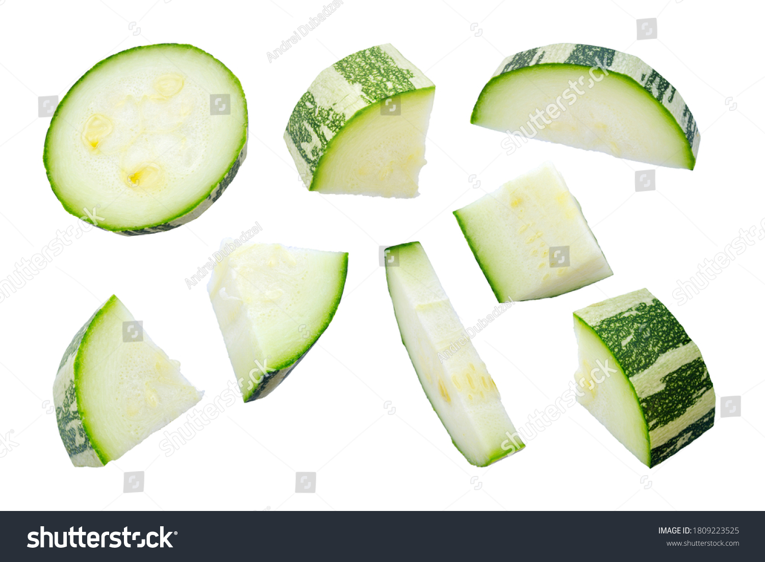 Zucchini slices isolated on a white background, top view. Sliced zucchini, courgette isolated on white. Pieces of zucchini, top view. Diced zucchini, closeup. Set of pieces of courgette. #1809223525