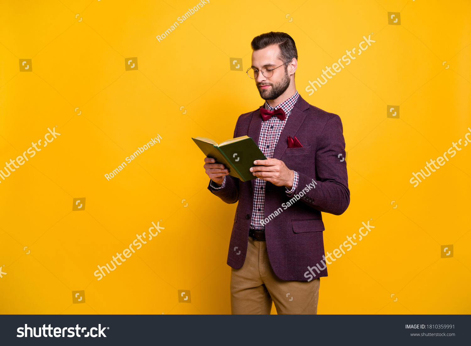 Portrait of his he nice attractive focused intellectual guy reading book academic learning free time knowledge library isolated over bright vivid shine vibrant yellow color background #1810359991