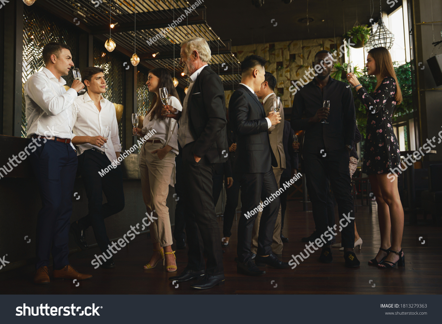 corporate businesspeople having fun and talking together in corporate party in club to celebrate spacial event such as corporate aniversary #1813279363