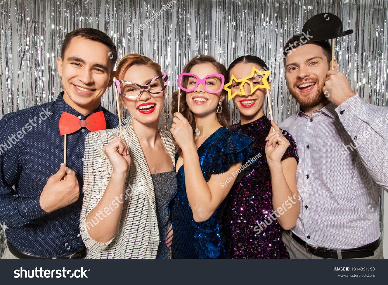 celebration, fun and holiday concept - happy friends posing with party props #1814391998