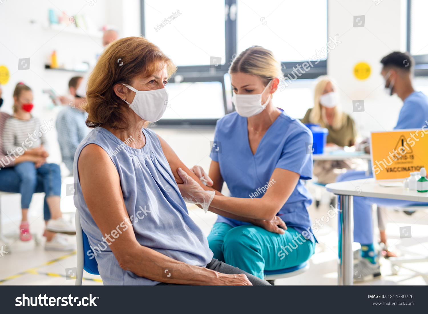 Woman with face mask getting vaccinated, coronavirus, covid-19 and vaccination concept. #1814780726