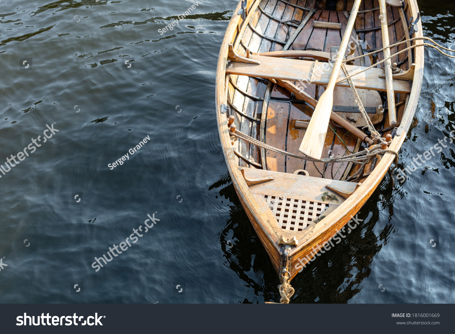 bow of a wooden boat with oars #1816001669