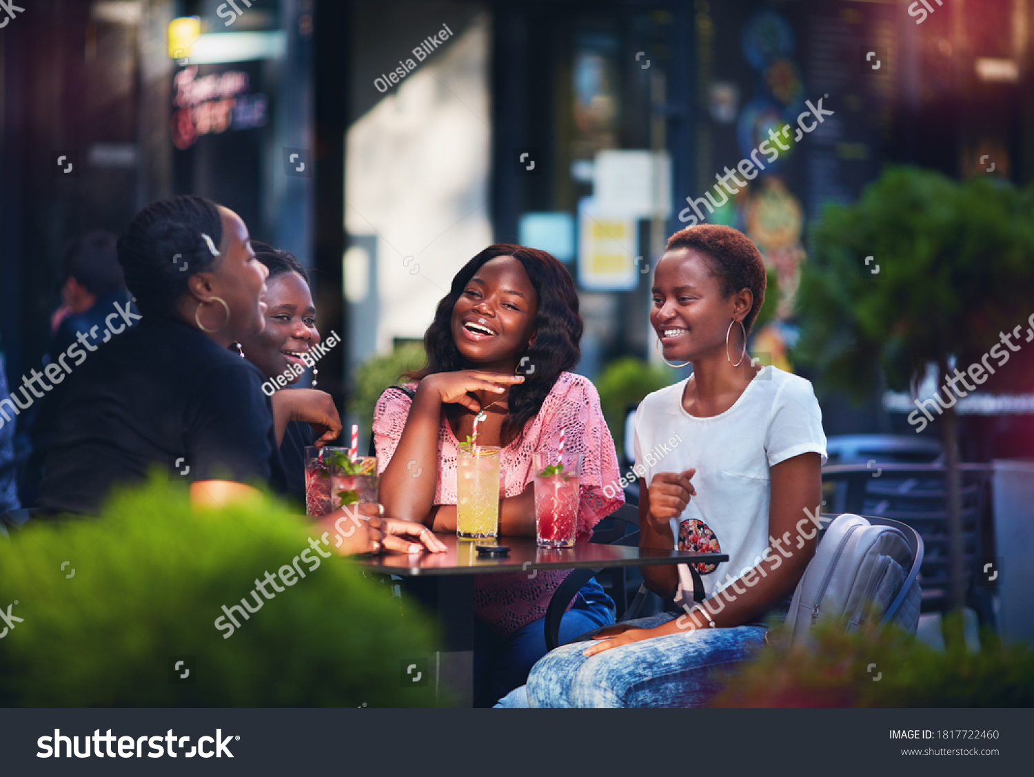 Happy African American Women, friends sitting together at the outdoor restaurant at summer day #1817722460