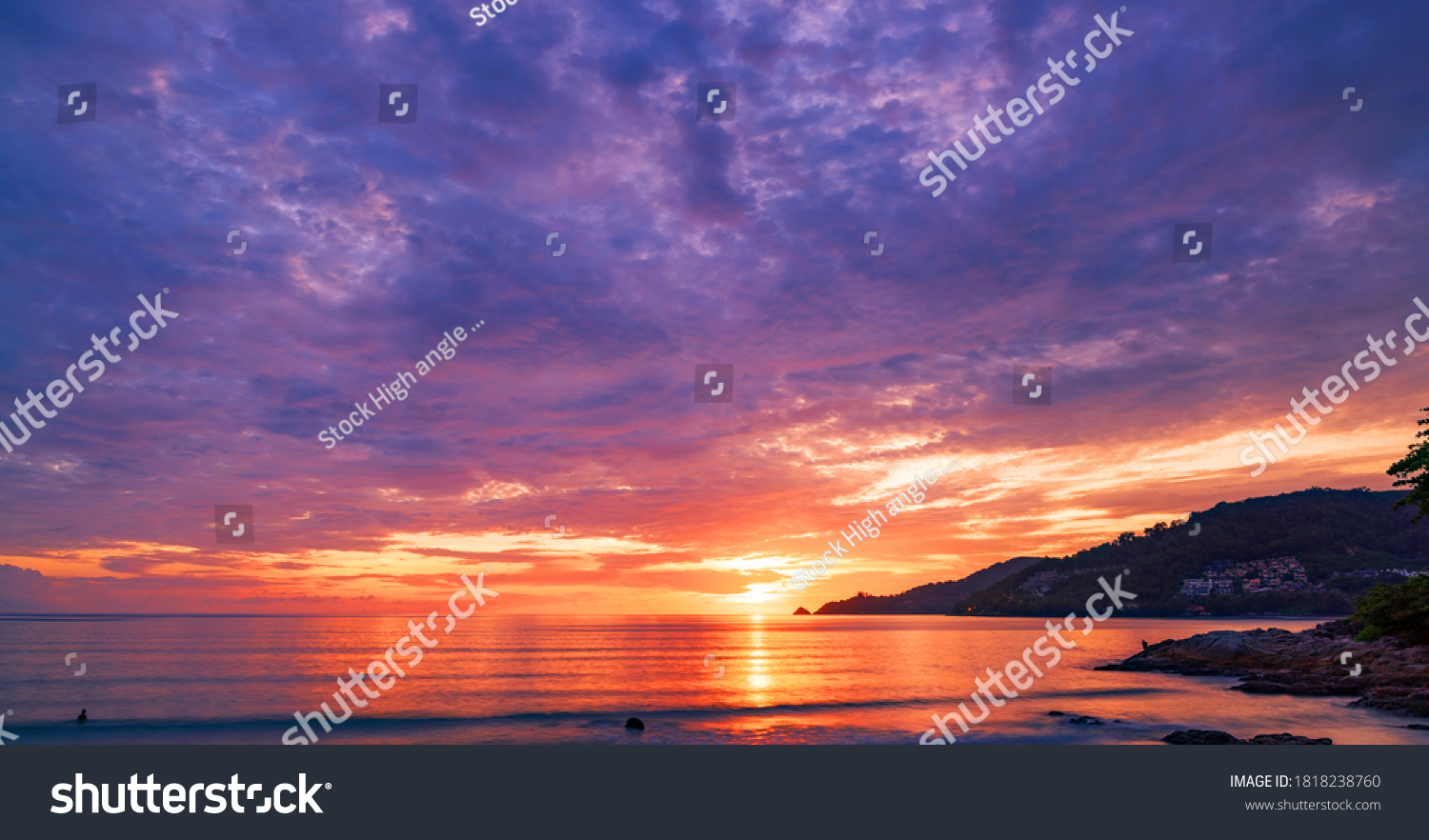 Landscape Long exposure of majestic clouds in the sky sunset or sunrise over sea with reflection in the tropical sea #1818238760