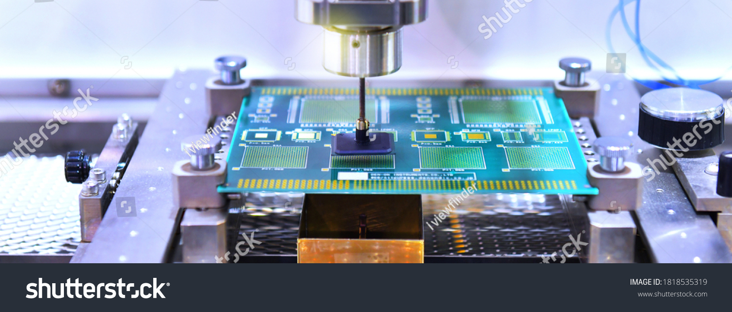 Technological process of soldering and assembly chip components on pcb board. Automated soldering machine inside at industrial, banner side #1818535319