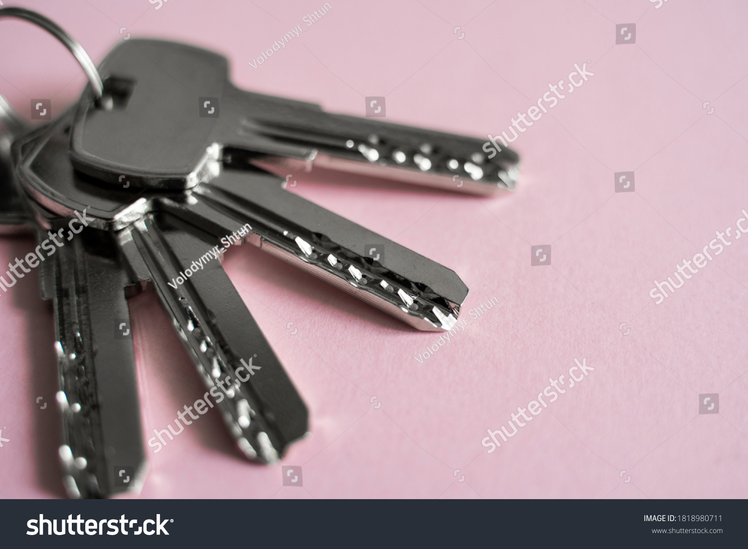 Door key lies on pink background. Set of keys. Bunch of keys. House key. New house concept. Rental and Selling. #1818980711