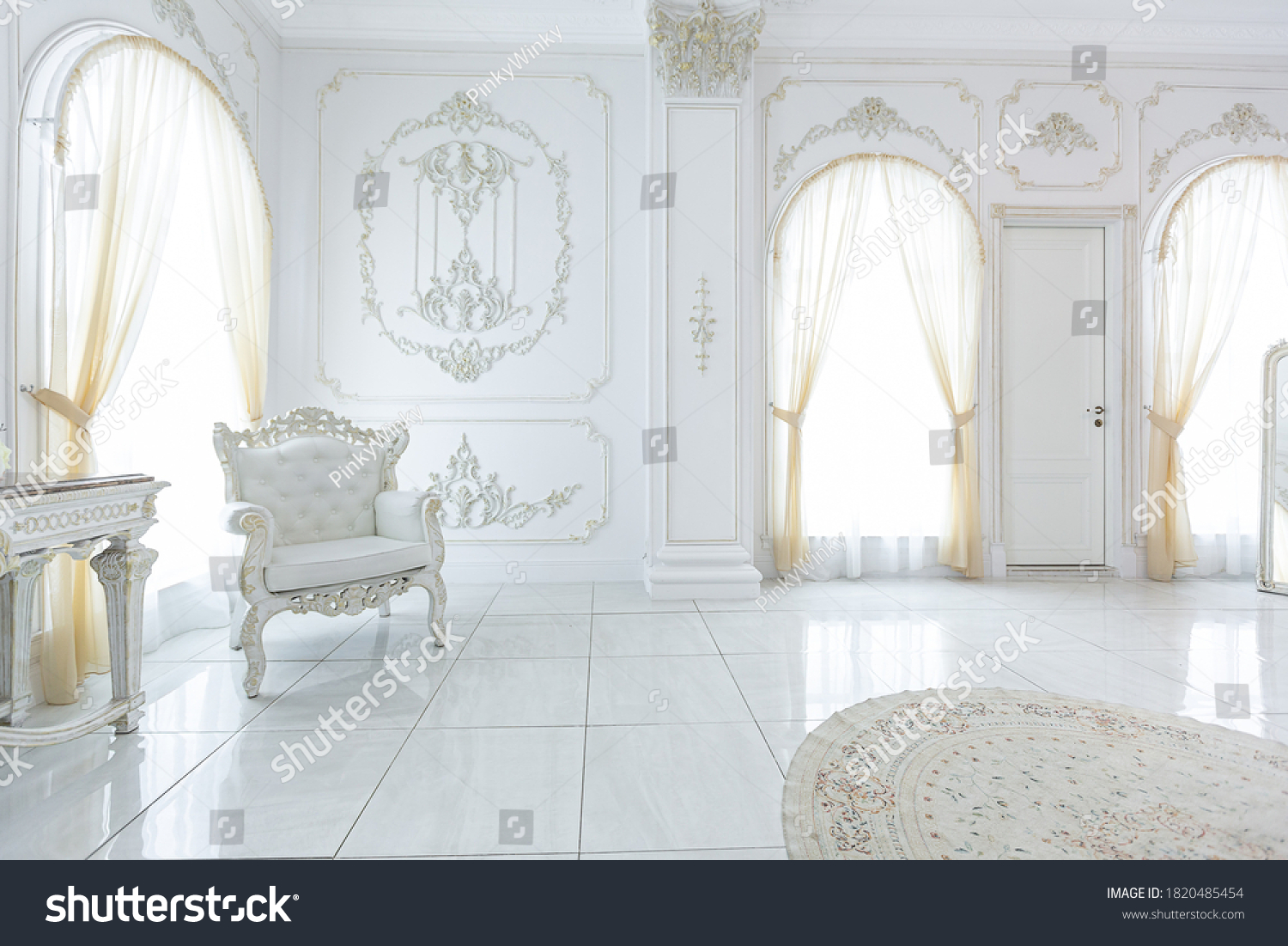 luxury royal posh interior in baroque style. very bright, light and white hall with expensive oldstyle furniture. large windows and stucco ornament decorations on the walls #1820485454