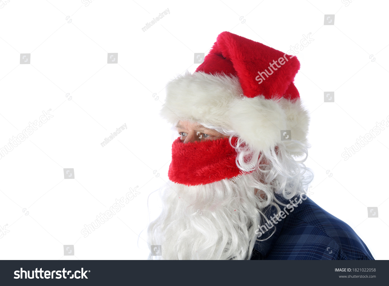 Casual Santa Claus Covid-19. Santa Wears a Blue Shirt, Santa Hat, Protective Face Mask on a causal day before Christmas. Isolated on white. Coronavirus is Dangerous even for Santa. #1821022058