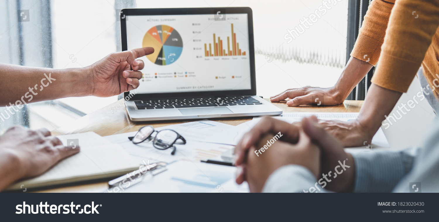 Business team collaboration discussing working analyzing with financial data and marketing growth report graph in team, presentation and brainstorming to strategy planning making profit of company. #1823020430