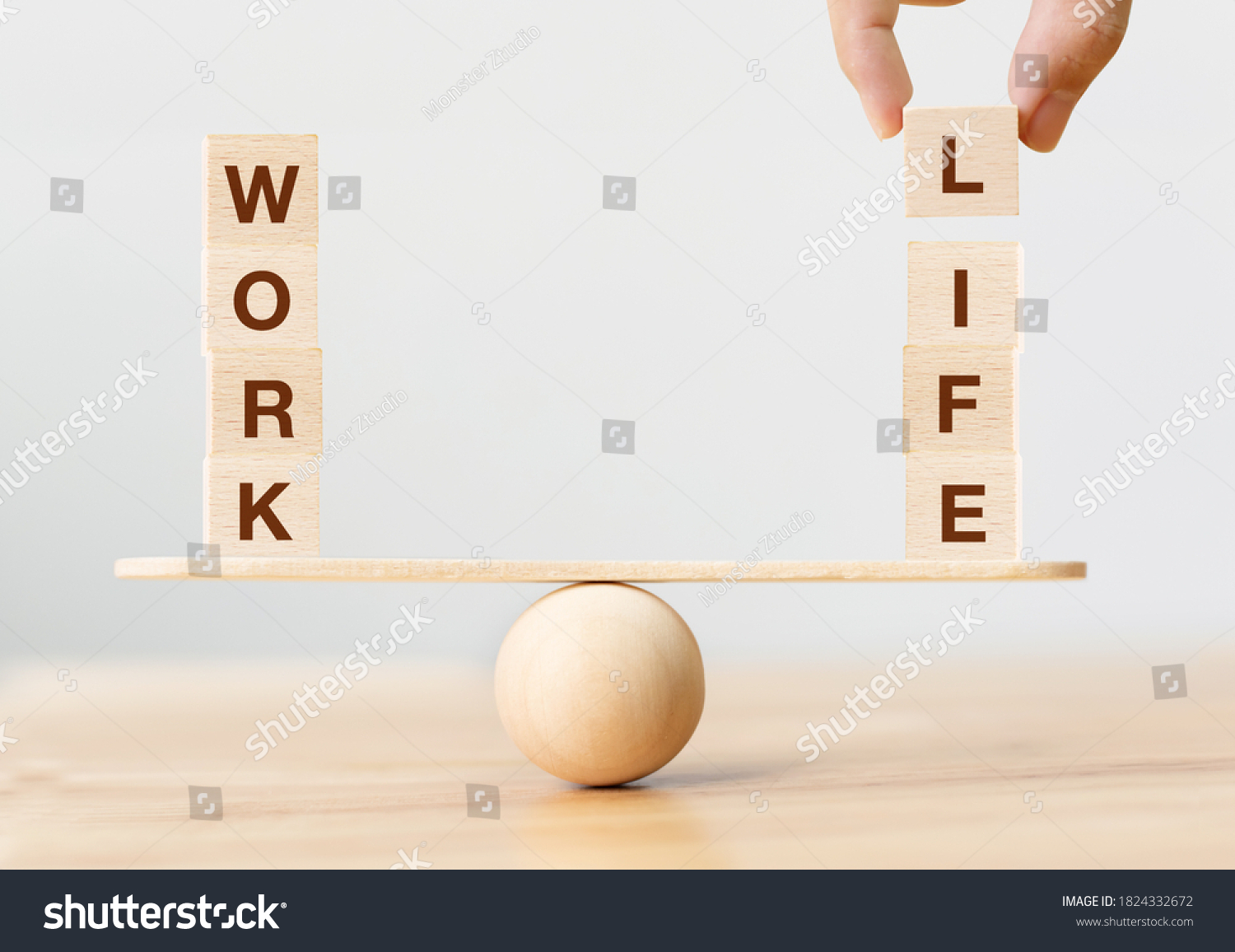 Work life balance concept. Wooden cube block with word WORK and LIFE on seesaw #1824332672