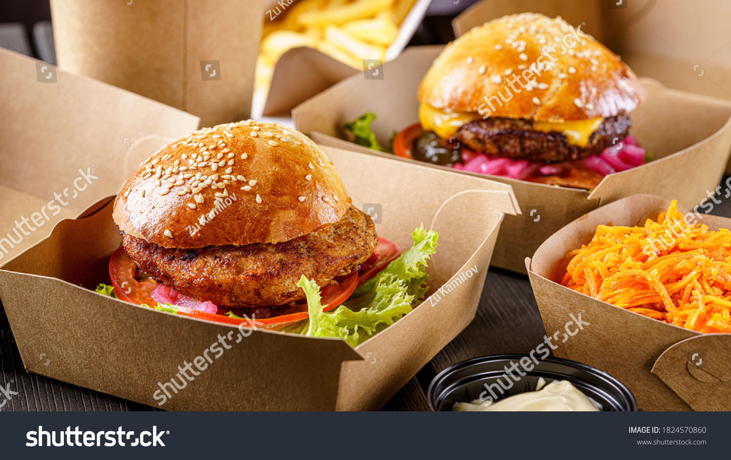 Street food. Meat cutlet burgers are in paper boxes. Food delivery. #1824570860