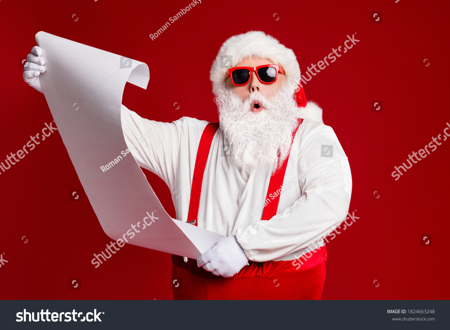 Portrait of his he attractive amazed fat white-haired Santa holding in hands reading wish present gift list pout lips order isolated bright vivid shine vibrant red burgundy maroon color background #1824663248