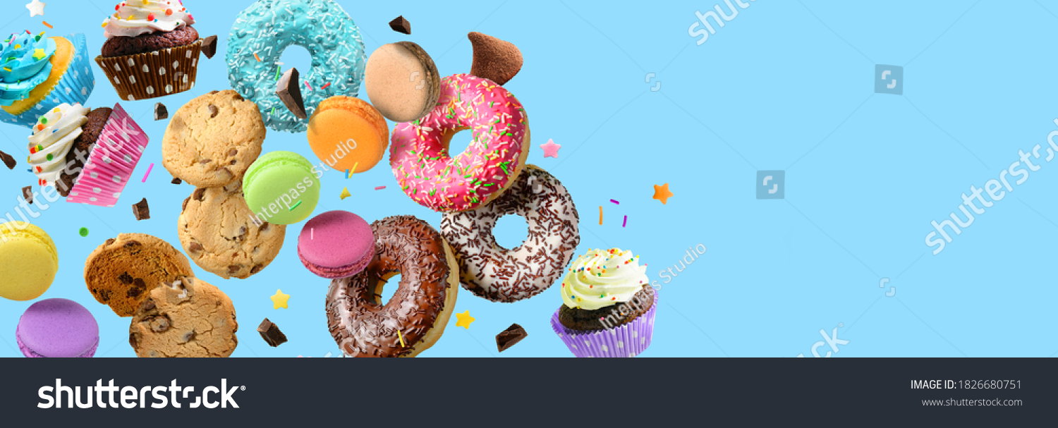 Cakes, sweets, confectionery collage background. Donuts, cookies cupcakes macaroons flying over blue background #1826680751