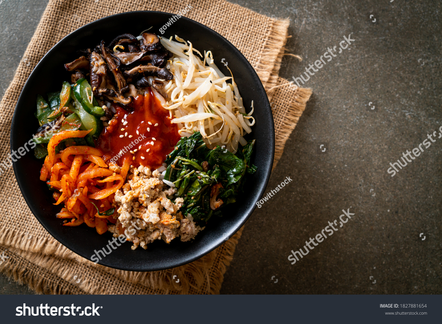 Bibimbap, Korean spicy salad with rice bowl - traditionally Korean food style #1827881654