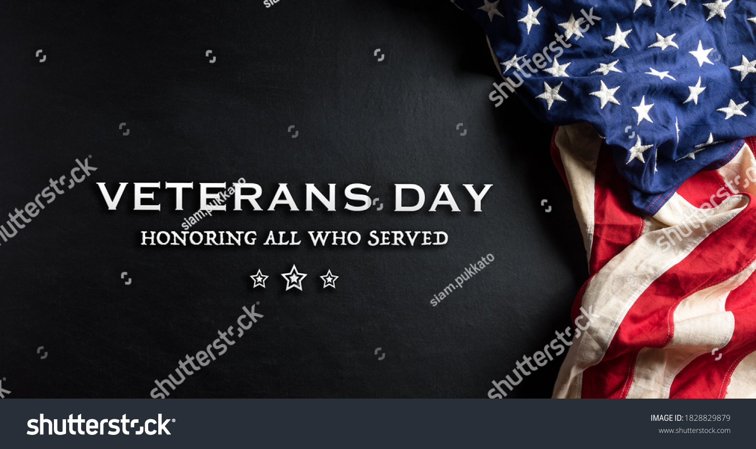 Happy Veterans Day concept. American flags against a blackboard background. November 11. #1828829879