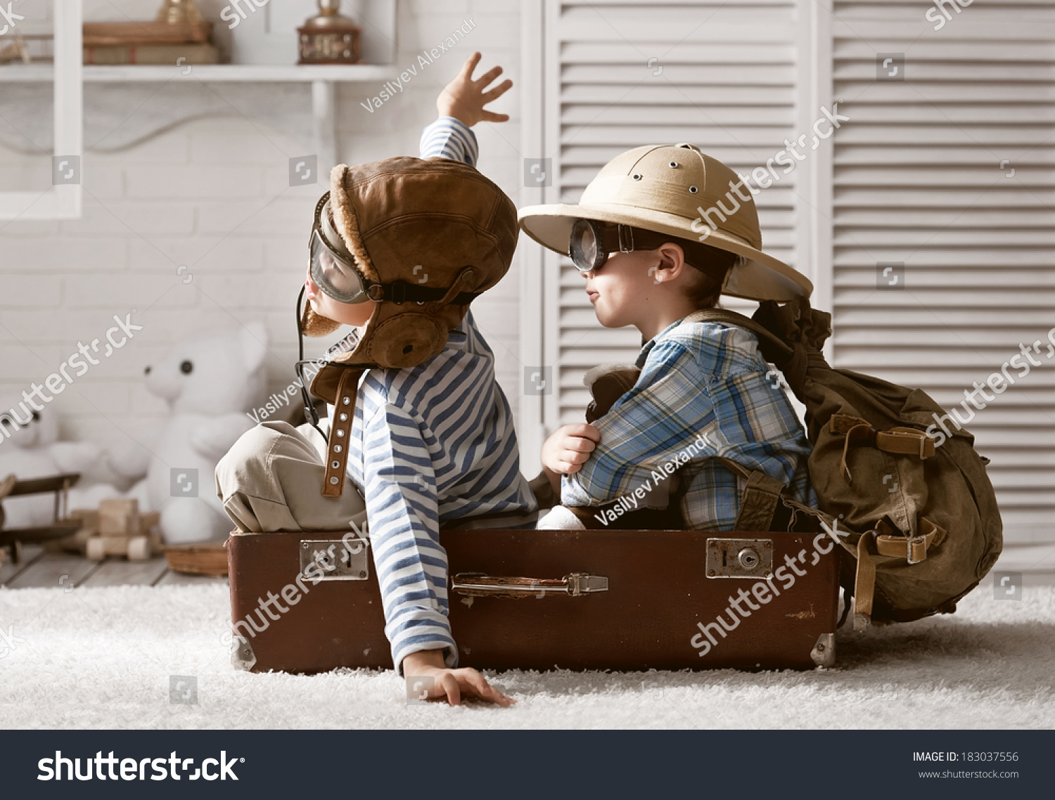 Two boys in the form of an aircraft pilot and traveler playing in her room #183037556