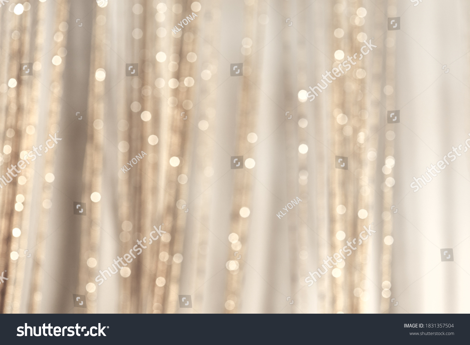 Abstract pastel blurred background. Mysterious Christmas defocused background. Festive frame with twinkling bokeh stars. Abstract blurred bokeh curtain.Tender background in milky gray tones. #1831357504