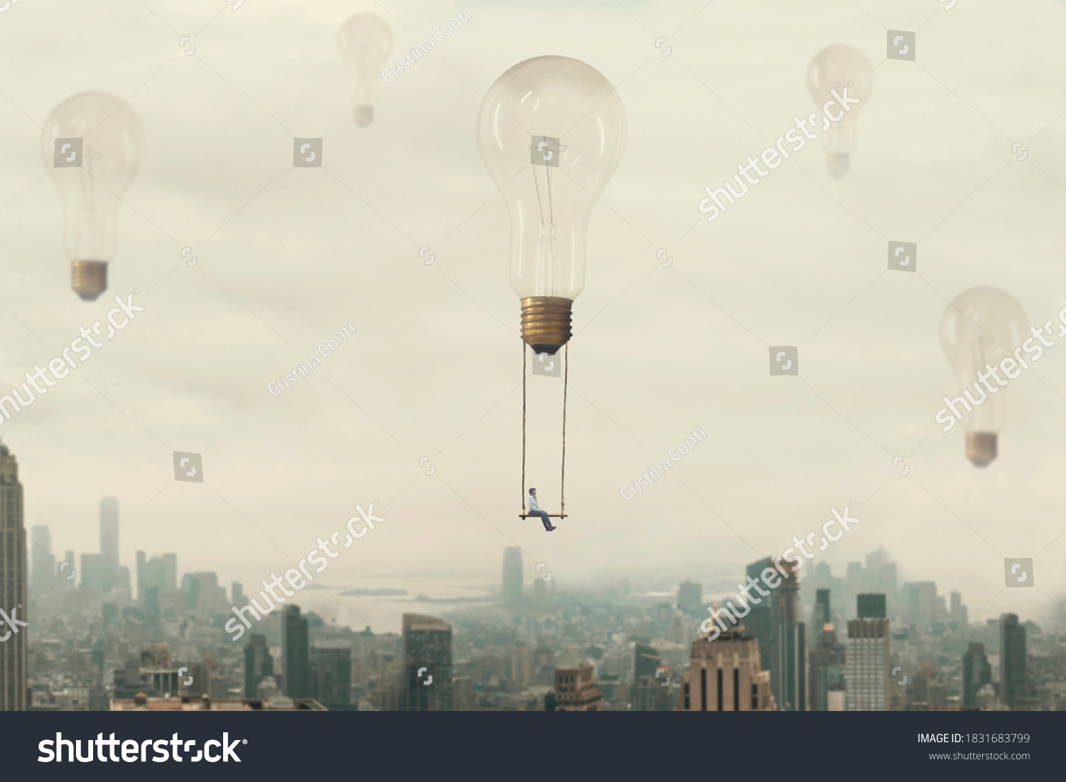 surreal moment of a woman traveling on a swing carried by a light bulb over a metropolis #1831683799