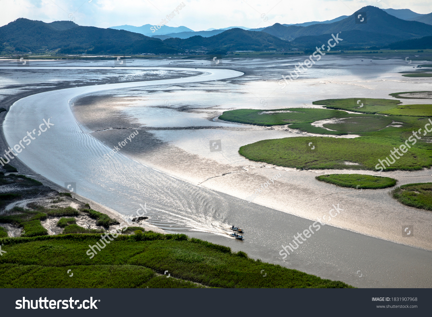 Aerial view of two fishing boats on the sea with mud flat at Suncheonman Bay of Waon Beach near Suncheon-si, South Korea
 #1831907968