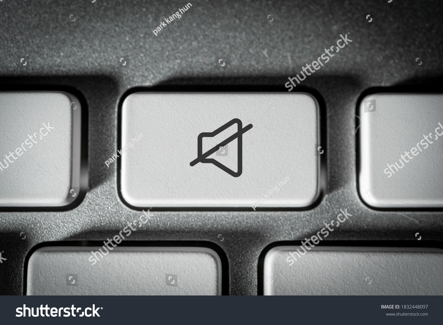 Mute key on a neat white keyboard #1832448097
