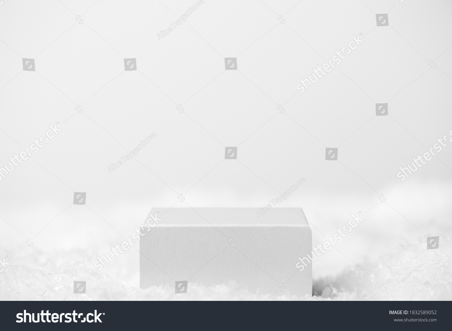 Podium geometric shape white on a white background. Winter scene, showcase with snow for product presentation. Minimalistic light pedestal for cosmetic. Copy space #1832589052