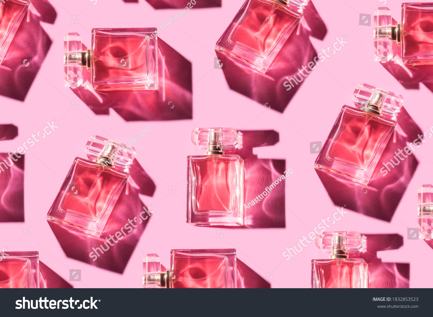 Pattern bottles of woman perfume on a pastel pink background, top view, flat lay. Mockup of pink fragrance perfume bottle mockup on pastel pink empty background #1832853523