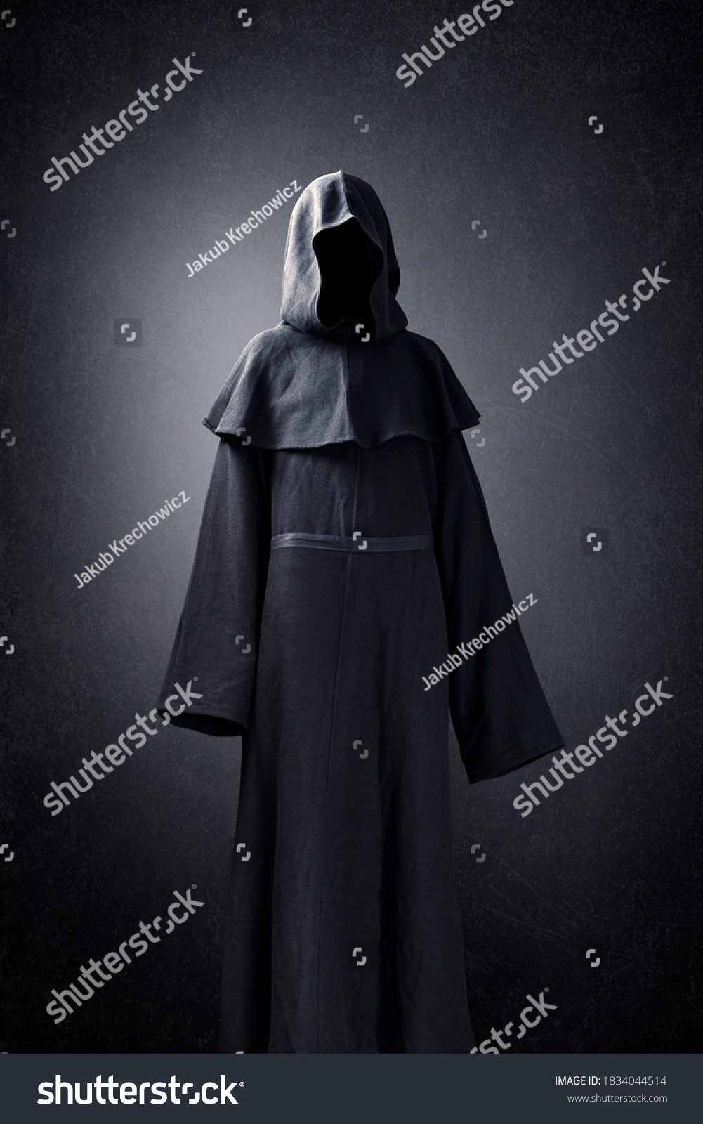 Scary figure in hooded cloak #1834044514