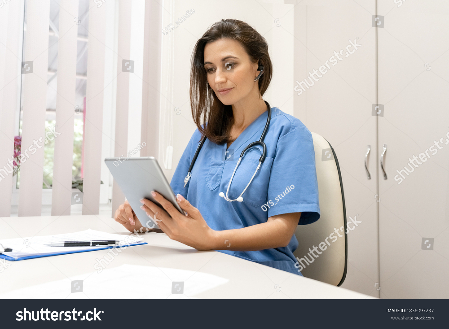 Telemedicine, Medical online, e health concept. Doctor video chat , explaining with patient via tablet computer, mobile health application. Doctor teleconferencing with medical team in hospital #1836097237