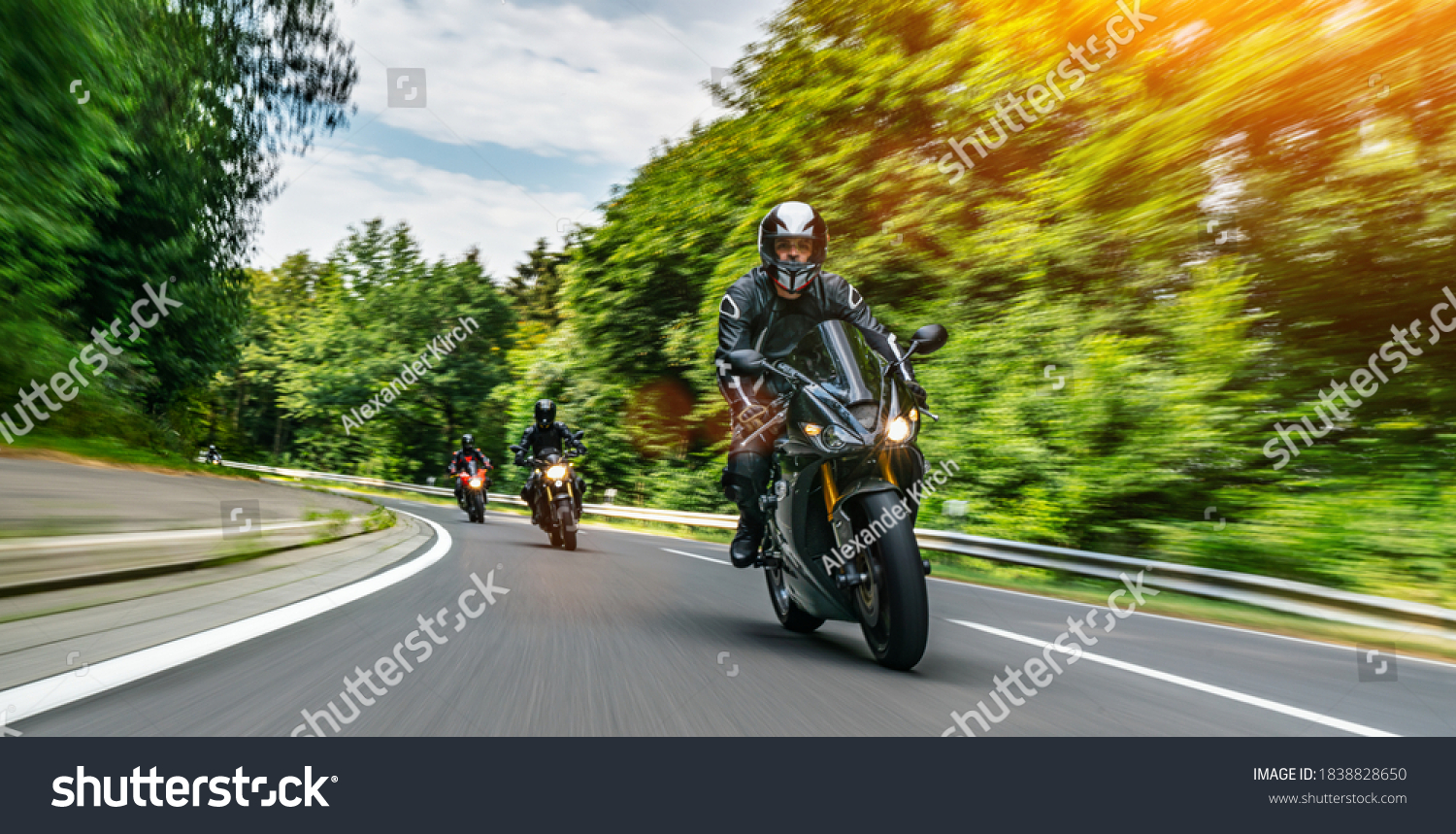 motorbike on the road riding. having fun driving the empty road on a motorcycle tour journey. copyspace for your individual text. Fast Motion Blur effect #1838828650