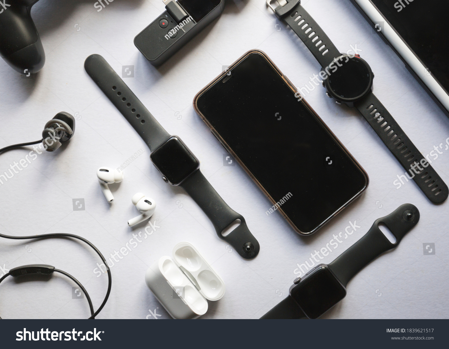 Flat lay shot of gadgets and mobile devices in white background.  #1839621517