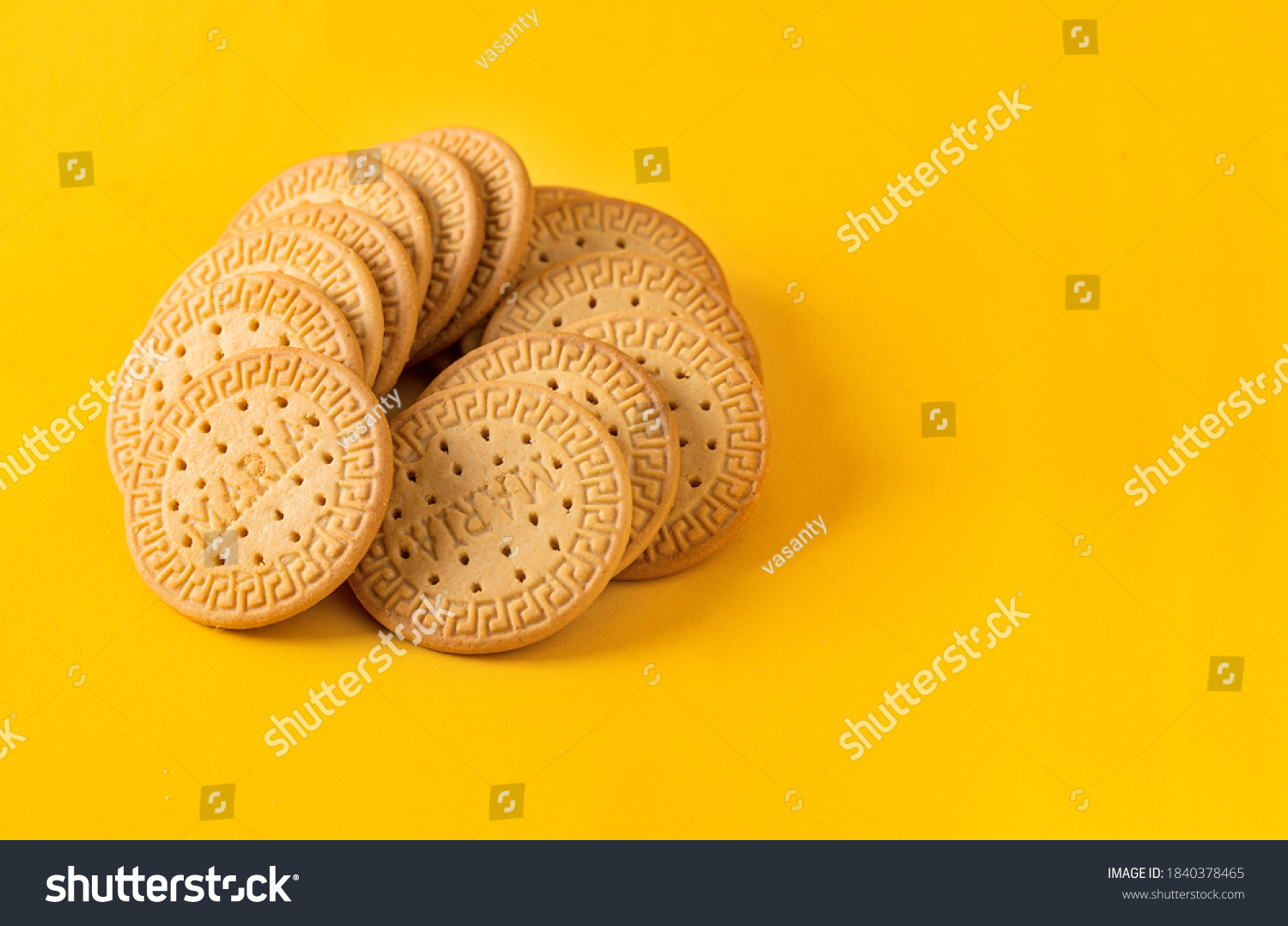 Many Marie biscuits  on bright yellow background. Modern cookies concept.  #1840378465