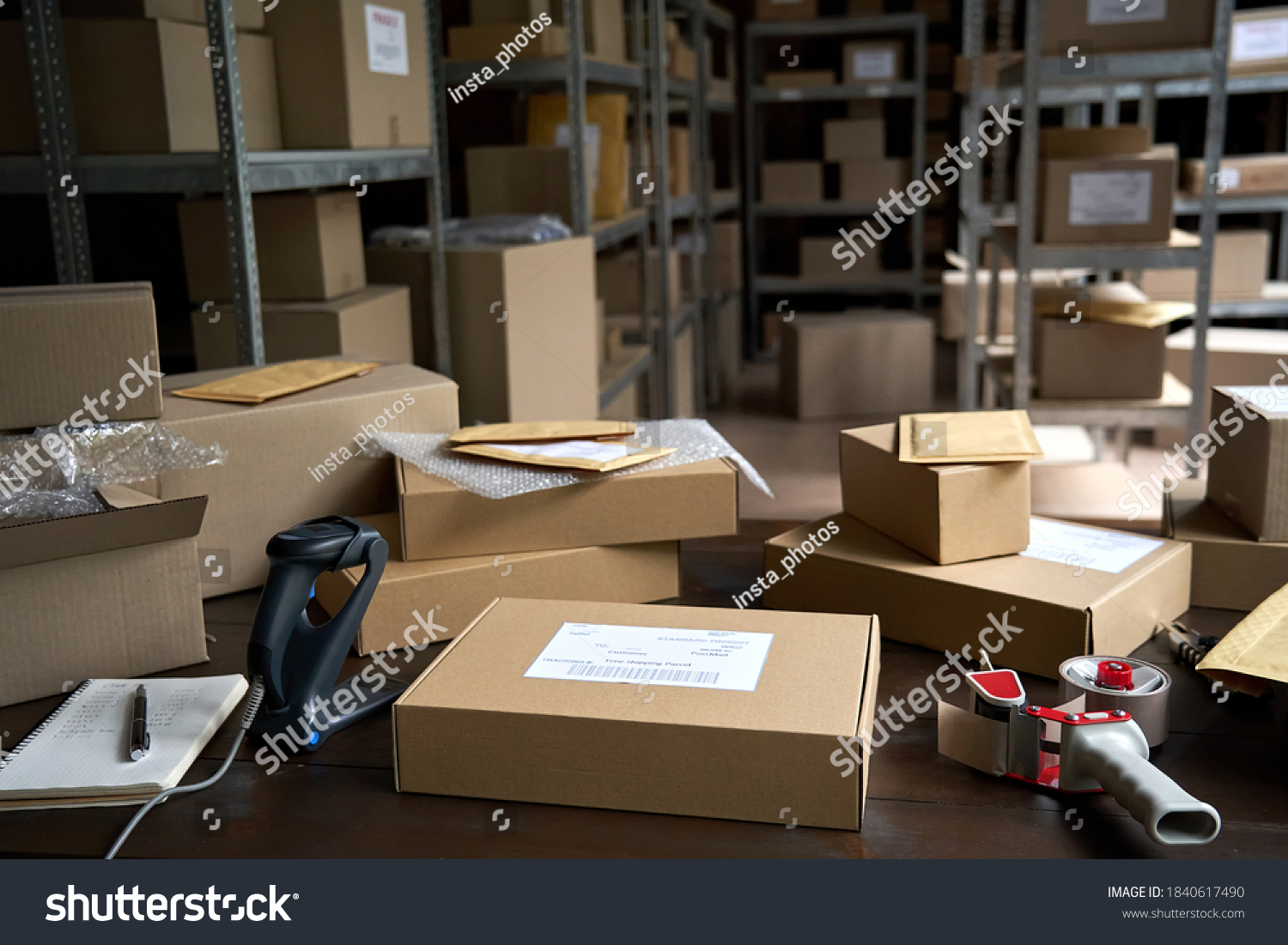Distribution warehouse background, commercial shipping order boxes for dispatching on stockroom table, post courier delivery package, dropshipping commerce retail store shipment storage concept. #1840617490