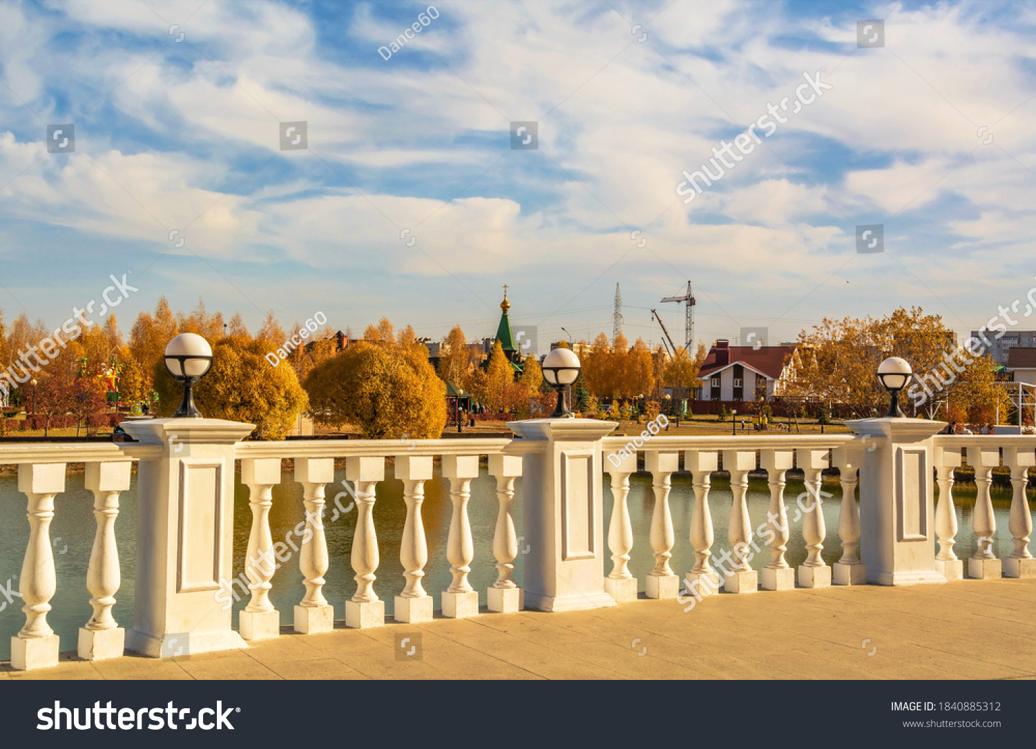 Embankment with beautiful terrace and parapet in the autumn city park #1840885312