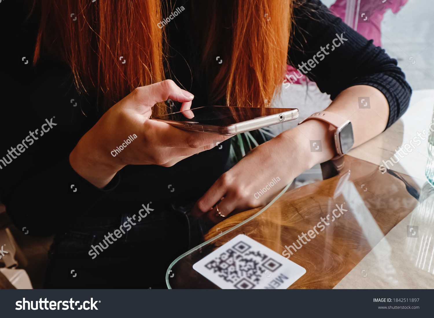 Woman scanning the barcode qr code in restaurant or cafe #1842511897